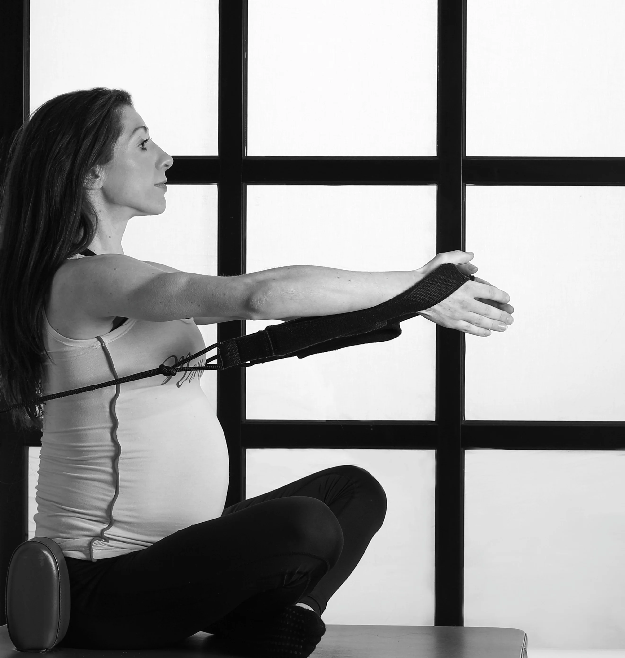 Pregnant mother performing pilates pose